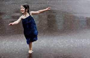 small girl in rain